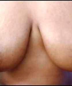 Firm brown big nipples on milk filled and squeezed tits