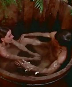 Redhead girl blows a cock on wooden tub